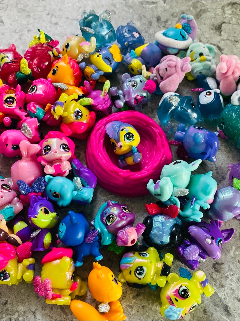 ~45 Hatchimals CollEGGtibles figures, including small iridescent neon-colour